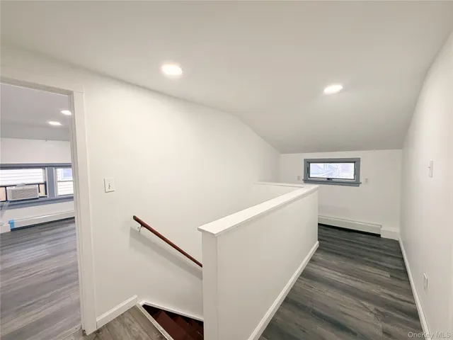 a view of entryway with wooden floor