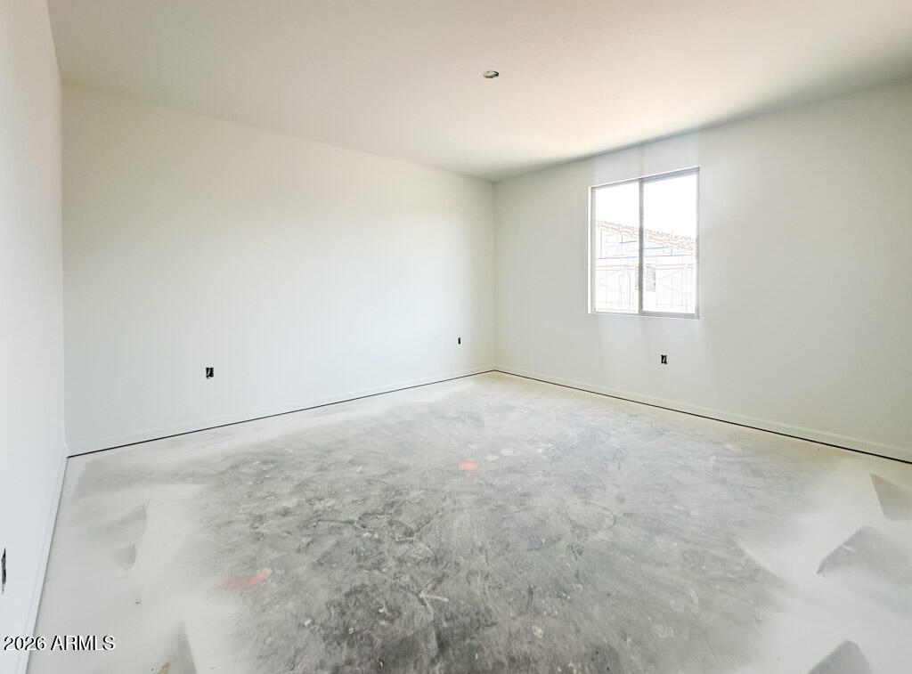 46953 North Dry Gulch Road Maricopa, AZ 85139 - Photo 5 of 16 a view of an empty room with a window