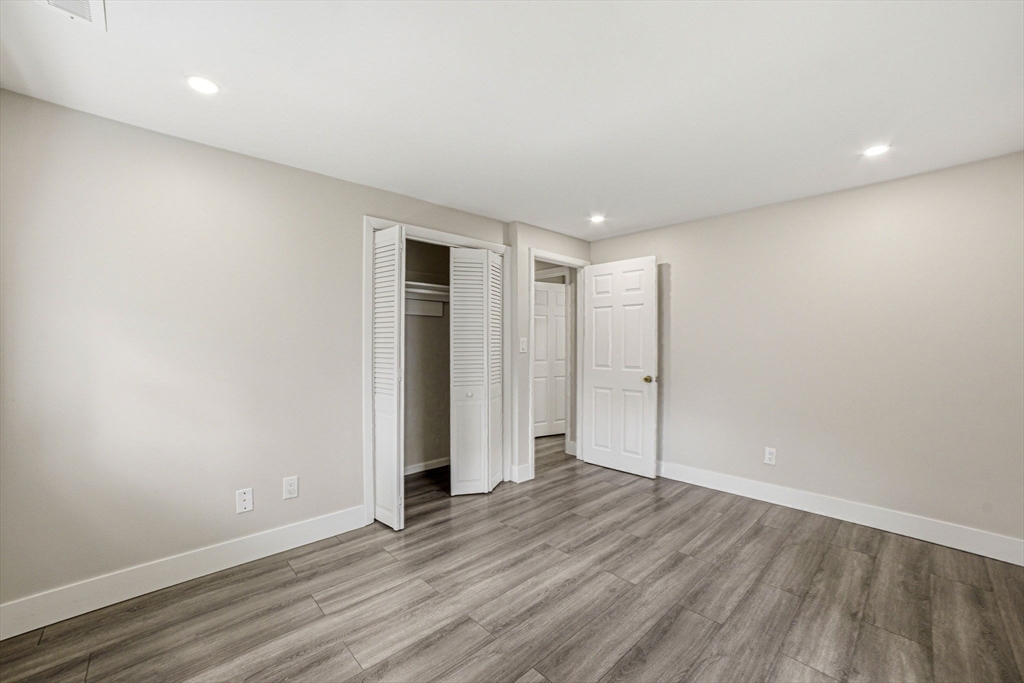 157 Errol Road Brockton, MA 02302 - Photo 23 of 34 a view of an empty room with wooden floor