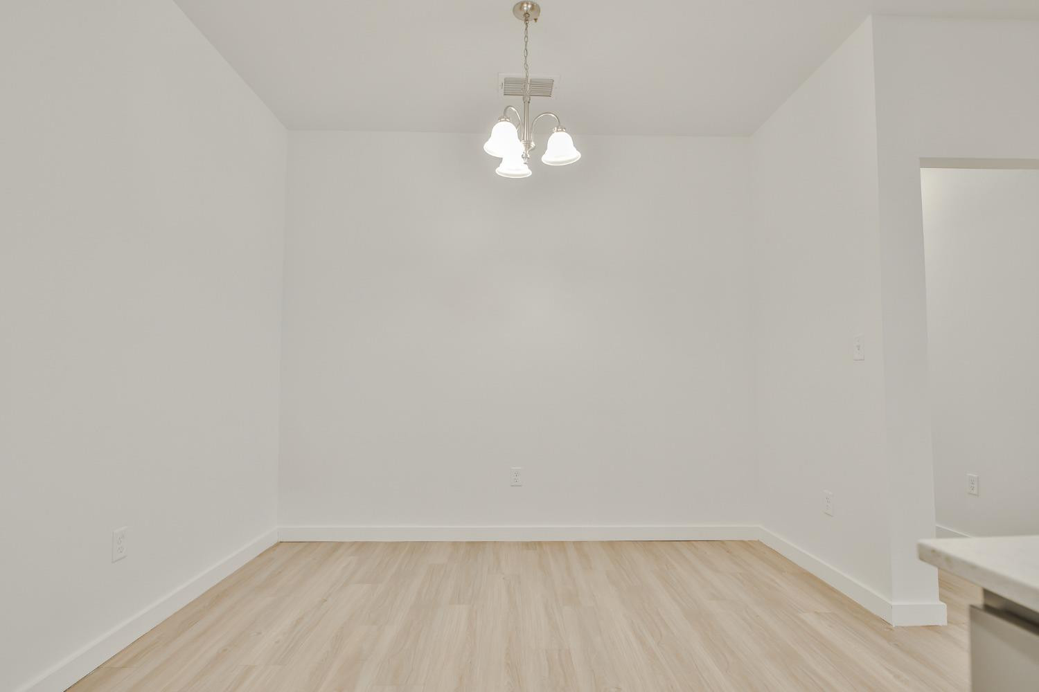 5508 Itasca Street Lubbock, TX 79416 - Photo 9 of 25 a view of empty room with wooden floor and fan