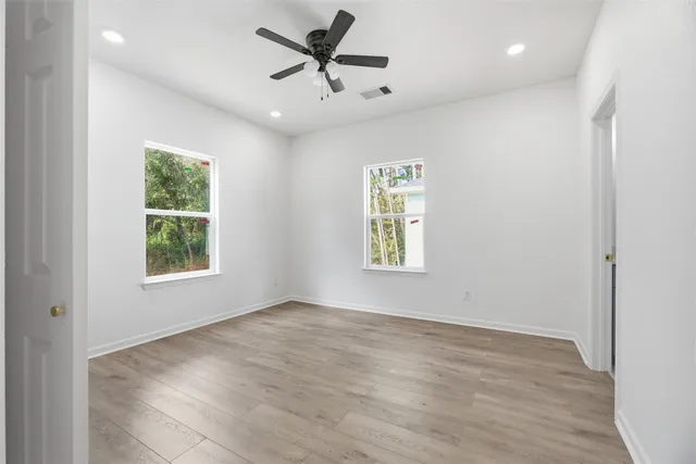 a view of an empty room and a window
