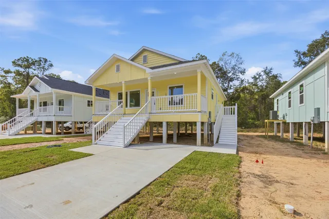a front view of a house with a yard table and chairs