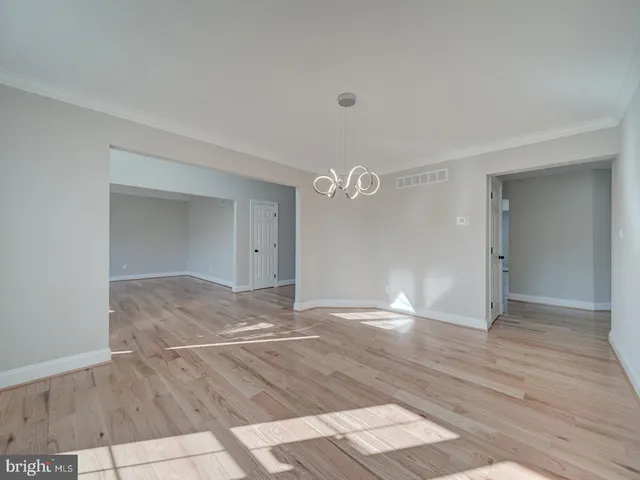 a bathroom with a granite countertop tub sink and window
