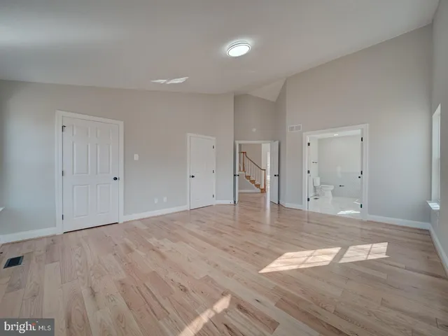 a kitchen with stainless steel appliances a stove a sink a microwave and cabinets