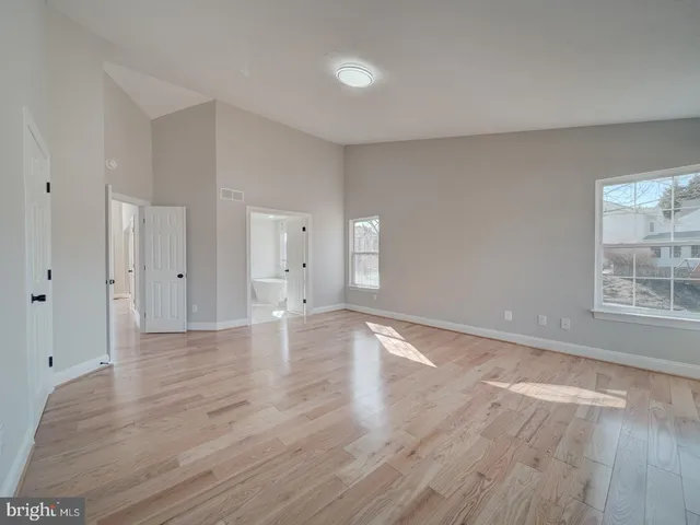a kitchen with a sink a stove and cabinets