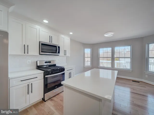 a bathroom with a toilet and a bathtub