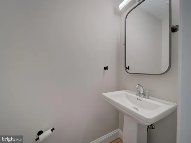 a view of an empty room and wooden floor