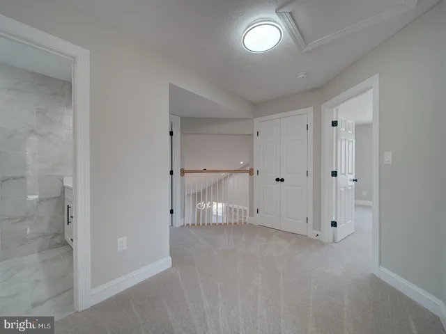 a view of a room with table and chairs
