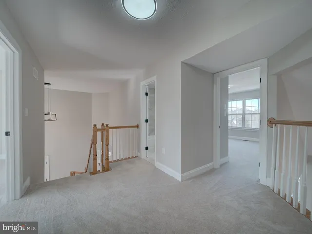 a view of a house with a snow in the background