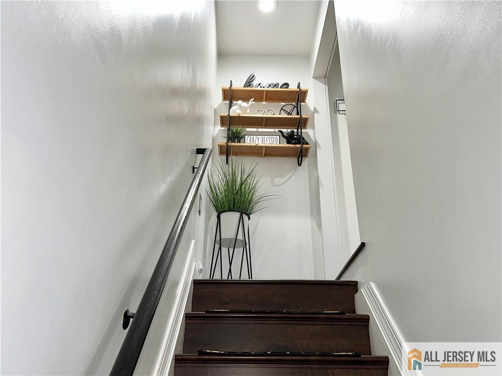 15 Halstead Road New Brunswick, NJ 08901 - Photo 17 of 45 a view of staircase with wooden floor