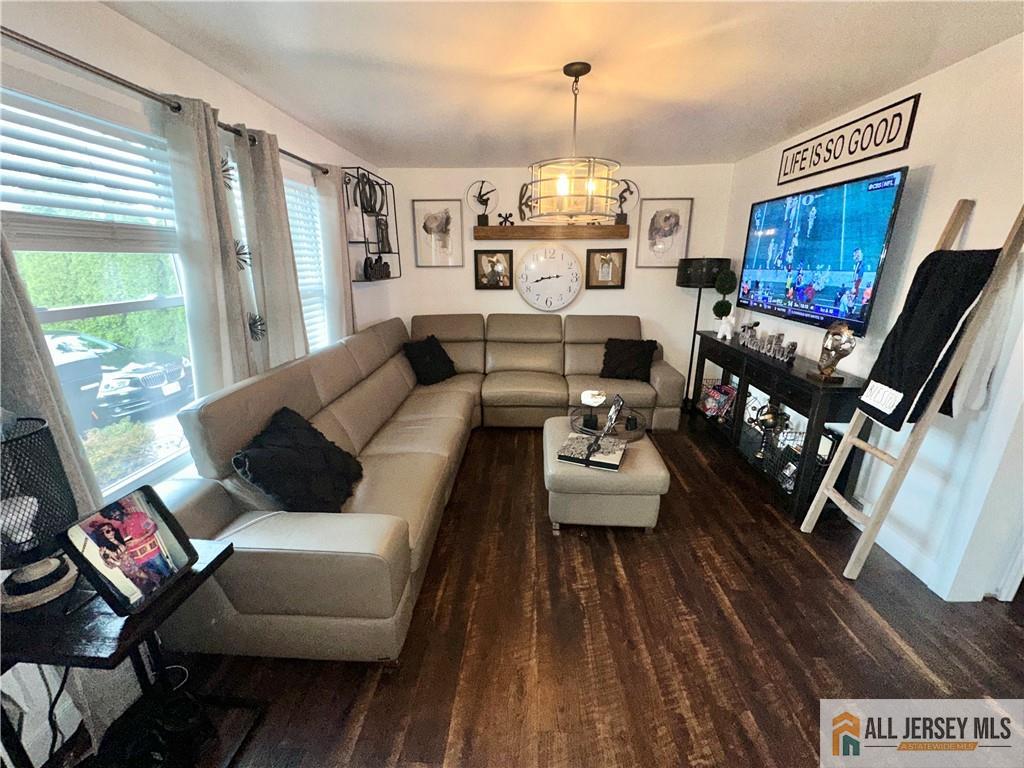 15 Halstead Road New Brunswick, NJ 08901 - Photo 4 of 45 a living room with furniture and a flat screen tv