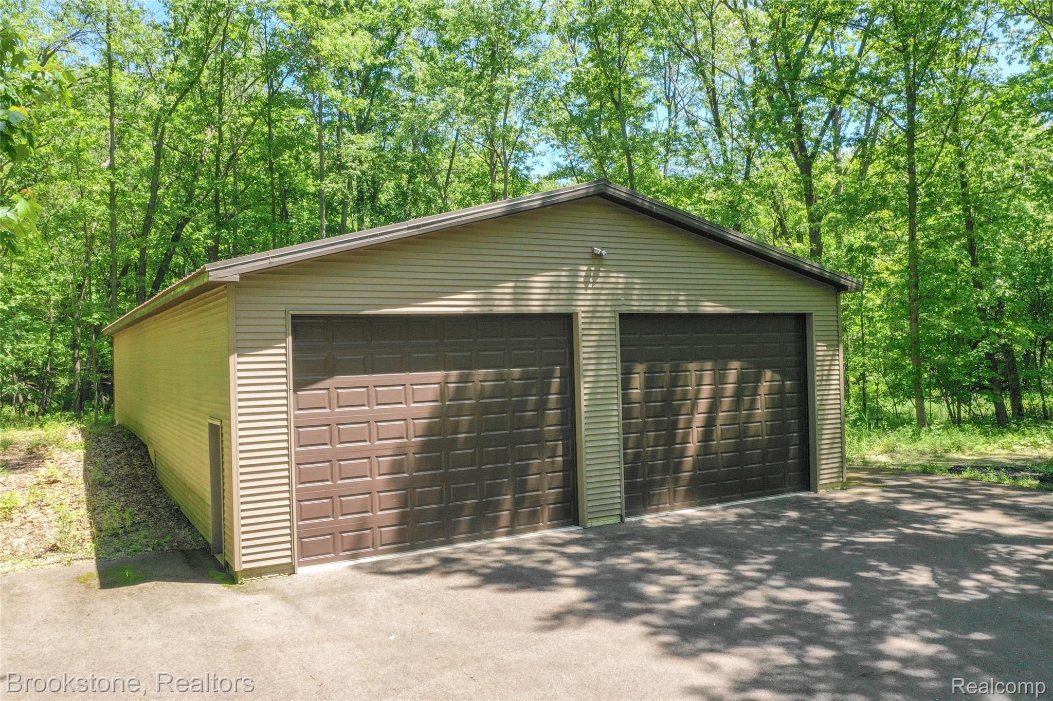 7868 Holcomb Road Clarkston, MI 48348 - Photo 8 of 60 Cement Floor, Electricity and Oversized Doors