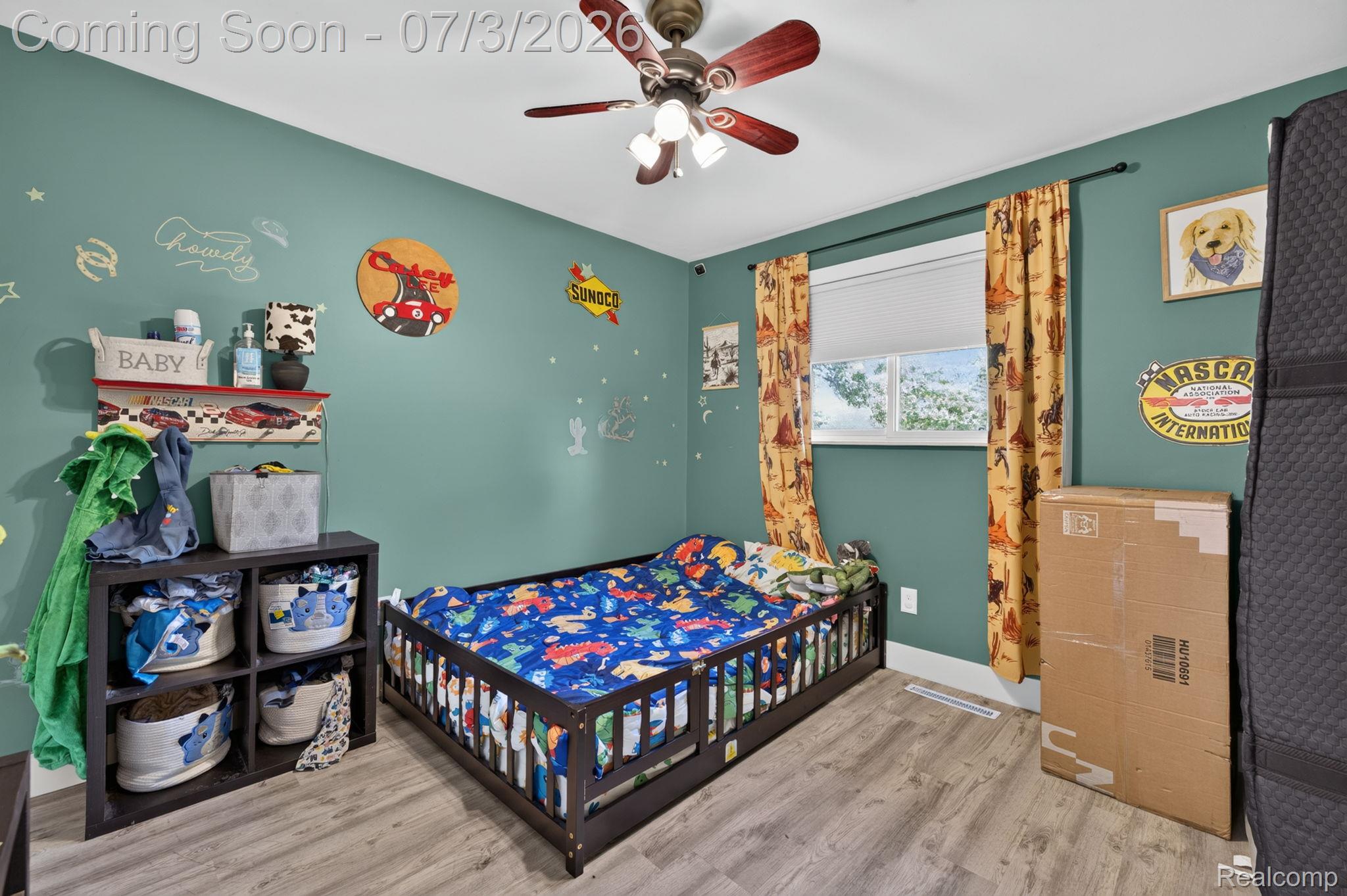 5355 North Seymour Road Flushing, MI 48433 - Photo 23 of 41 Interior room featuring wood-finish flooring, a ceiling fan with integrated lighting, and a window with blinds