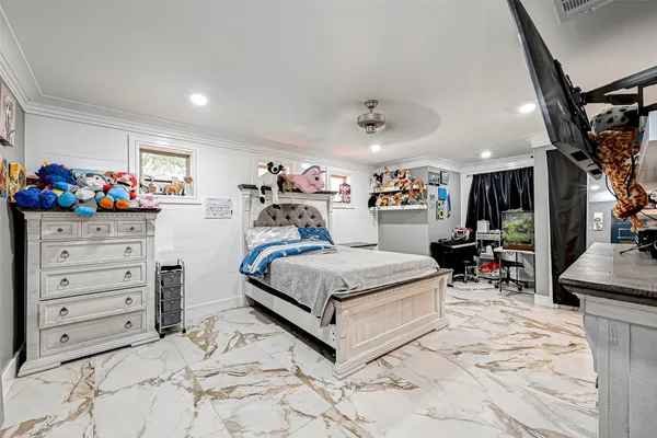 a bed room with a bed and a chair