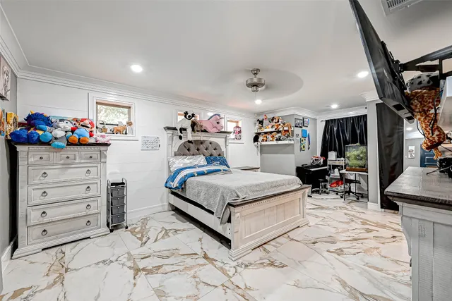 a bed room with a bed and a chair