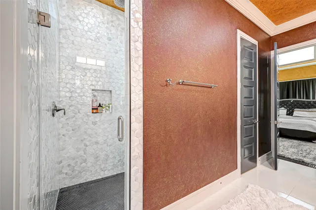 a bathroom with a shower and a sink
