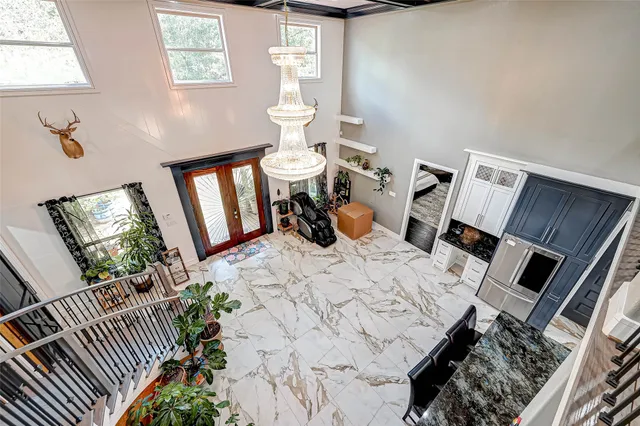 a bed room with a bed mirror and a window