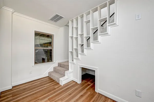 a living room with fireplace furniture and a window