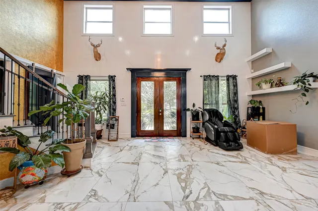 a view of a livingroom with furniture and a window