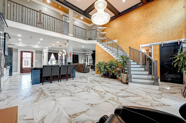 a view of a patio with a table and chairs and potted plants