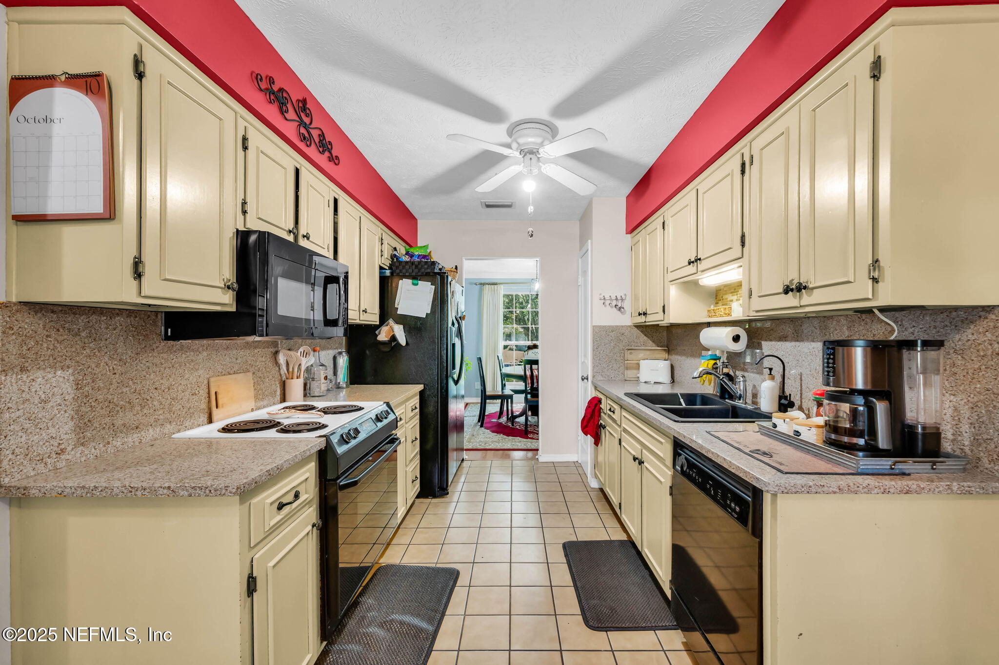 5495 Forrest Drive Orange Park, FL 32073 - Photo 11 of 34 a kitchen with stainless steel appliances granite countertop a refrigerator a stove top oven a sink and dishwasher