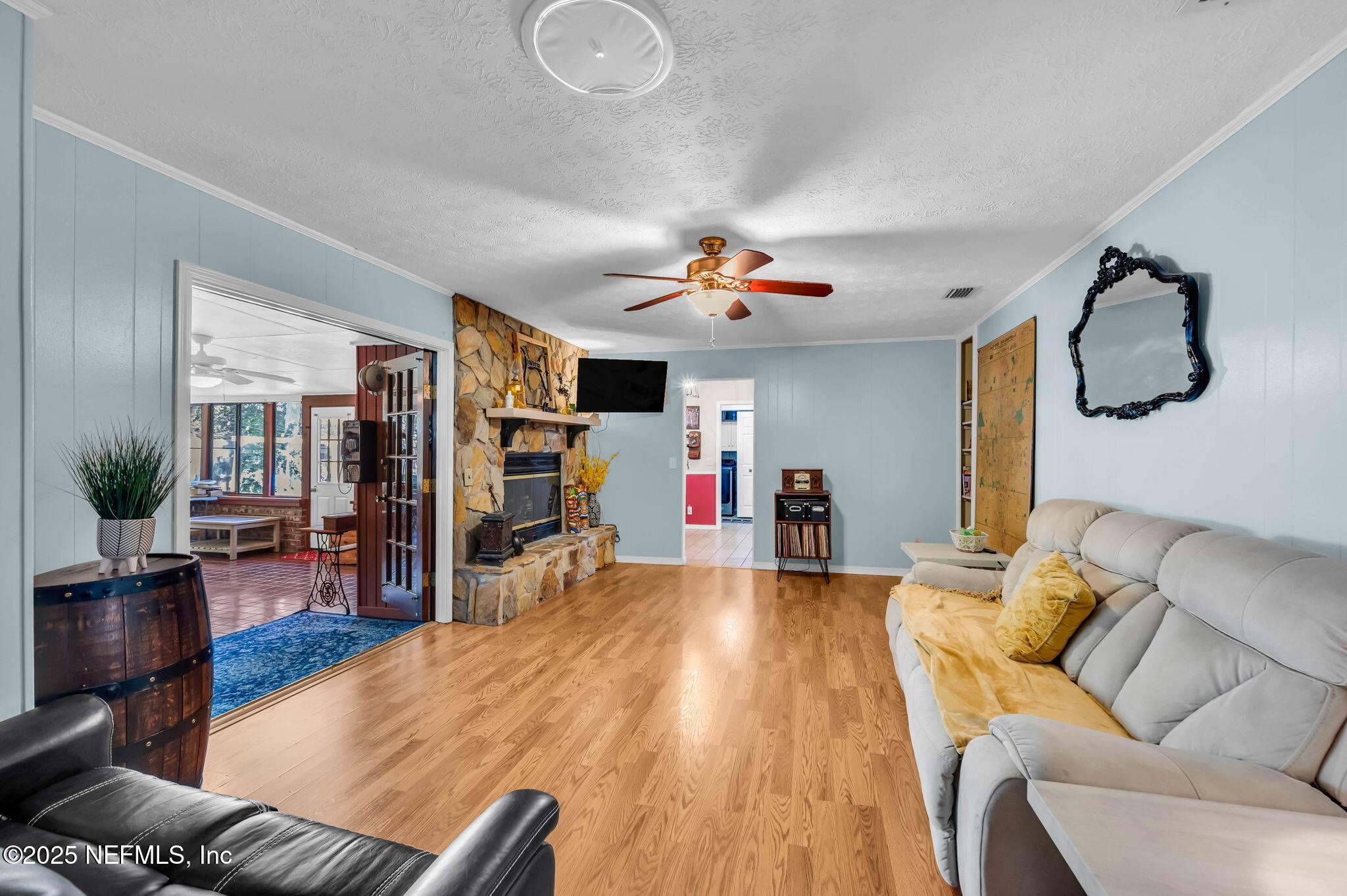 5495 Forrest Drive Orange Park, FL 32073 - Photo 15 of 34 a living room with furniture and a flat screen tv