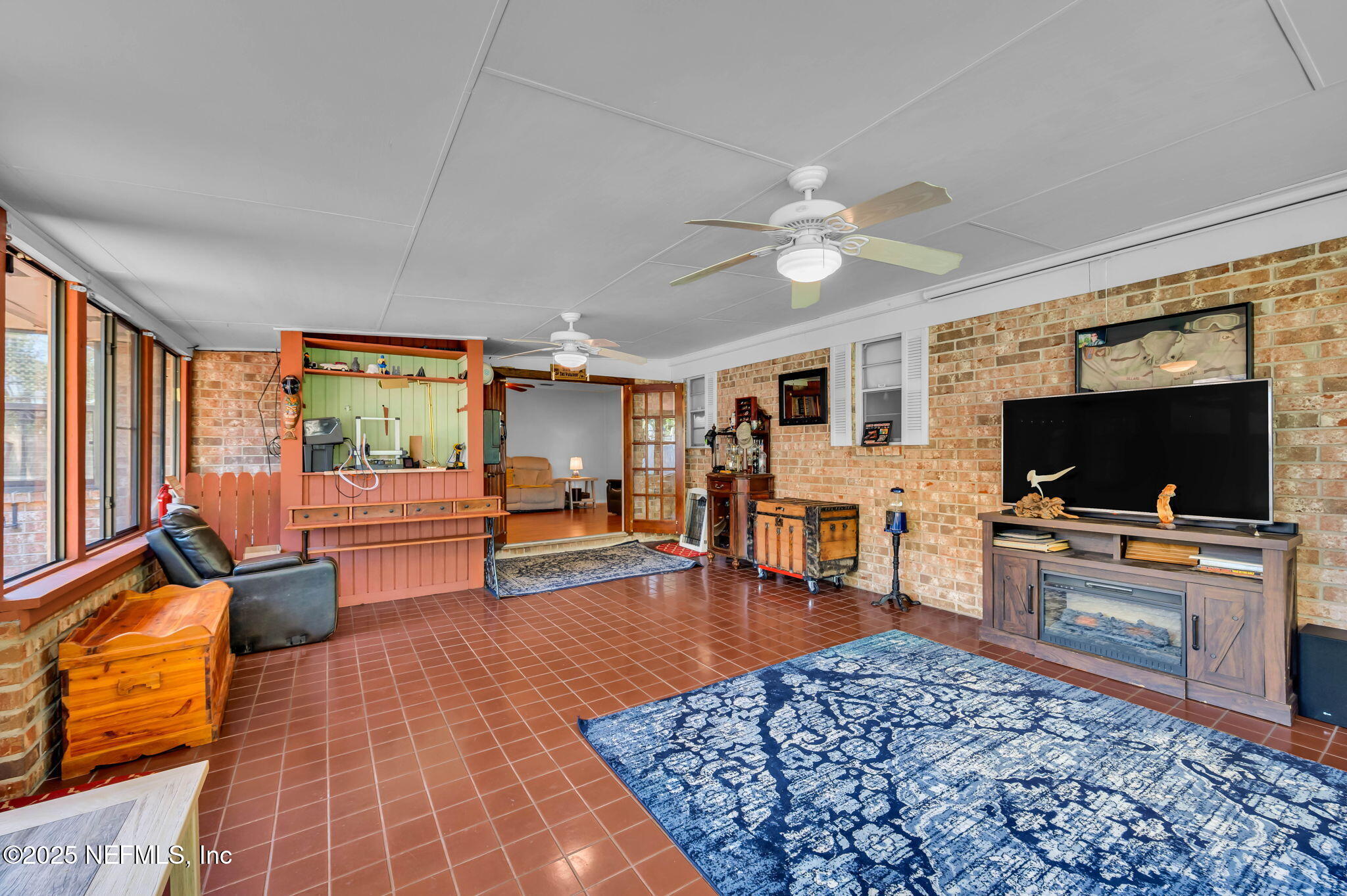 5495 Forrest Drive Orange Park, FL 32073 - Photo 17 of 34 a living room with furniture and a flat screen tv