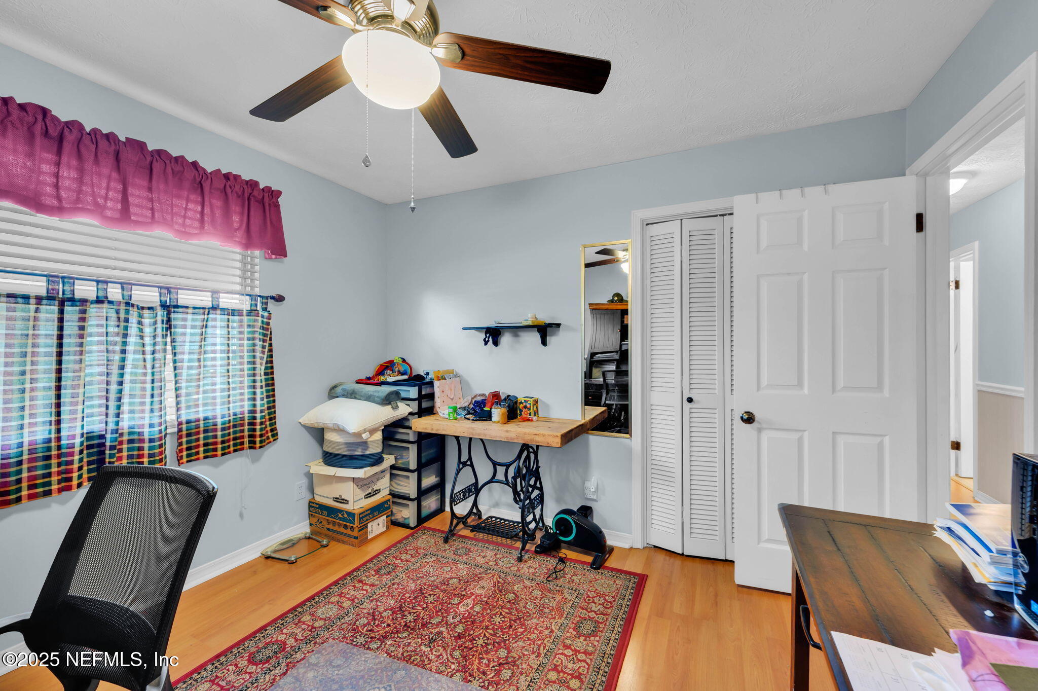 5495 Forrest Drive Orange Park, FL 32073 - Photo 24 of 34 a view of a workspace with furniture and a window