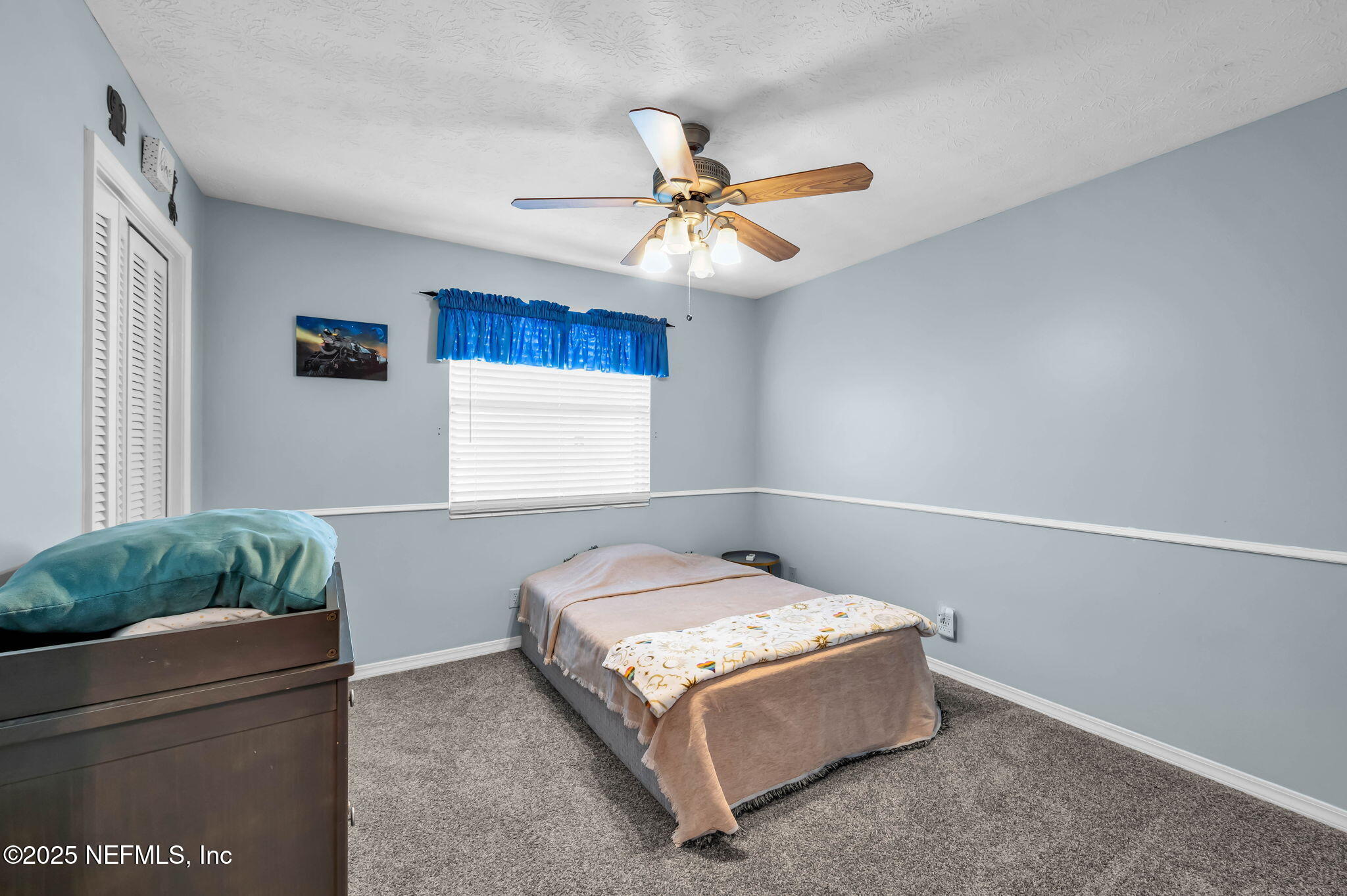 5495 Forrest Drive Orange Park, FL 32073 - Photo 25 of 34 a bed room with a bed and a window
