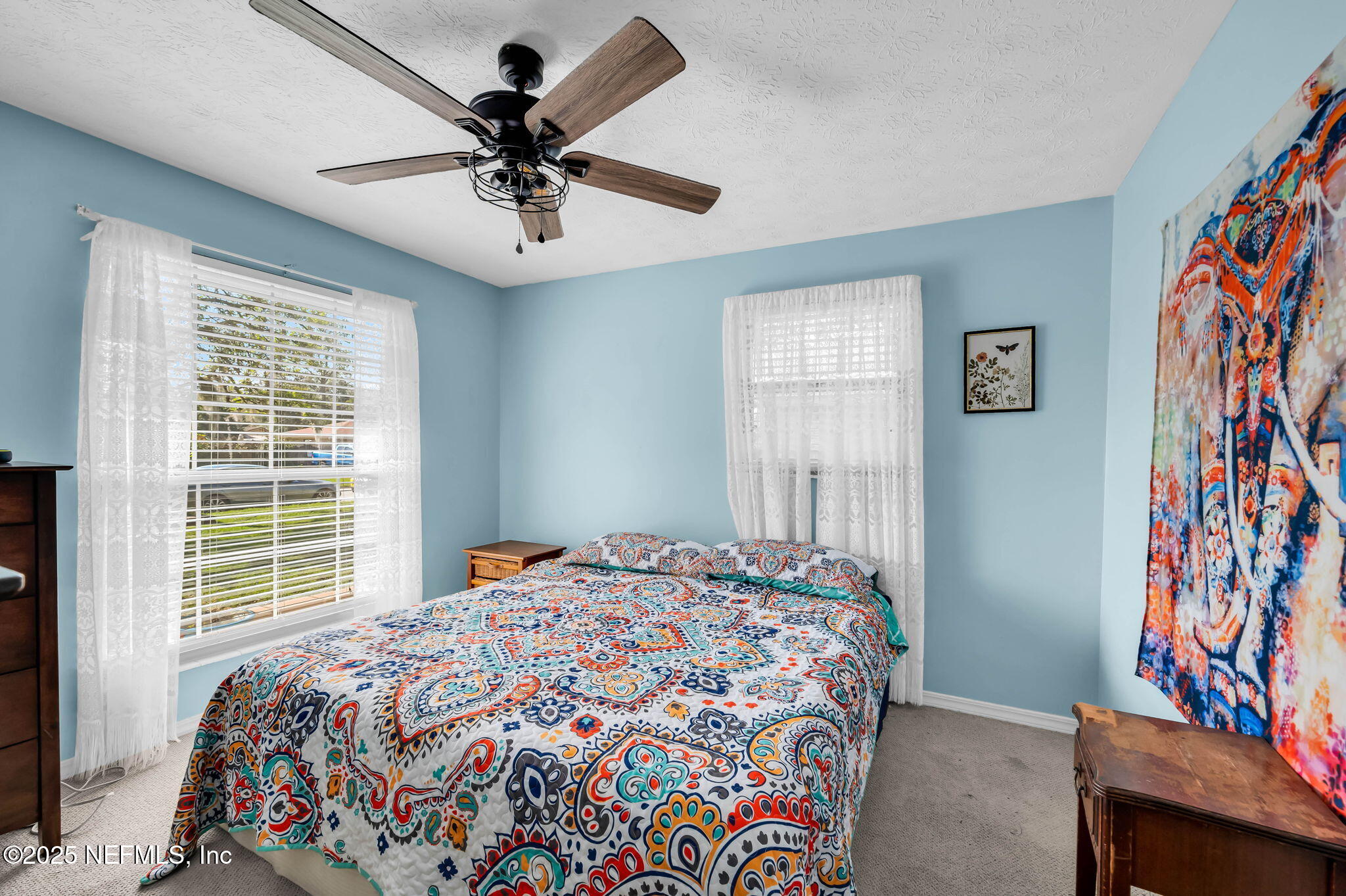 5495 Forrest Drive Orange Park, FL 32073 - Photo 27 of 34 a bedroom with a bed and a window
