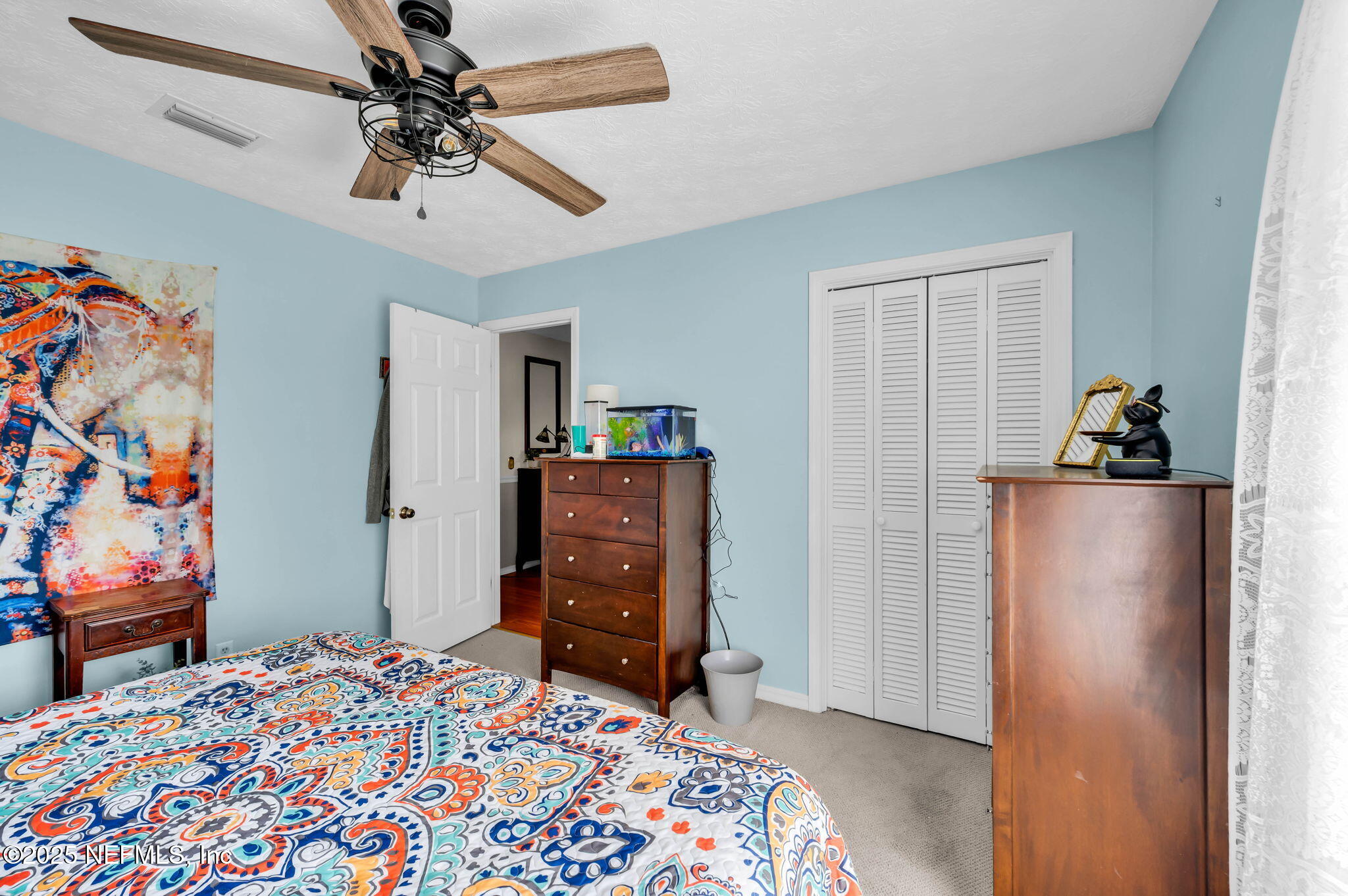 5495 Forrest Drive Orange Park, FL 32073 - Photo 28 of 34 a bedroom with a bed and wooden floor