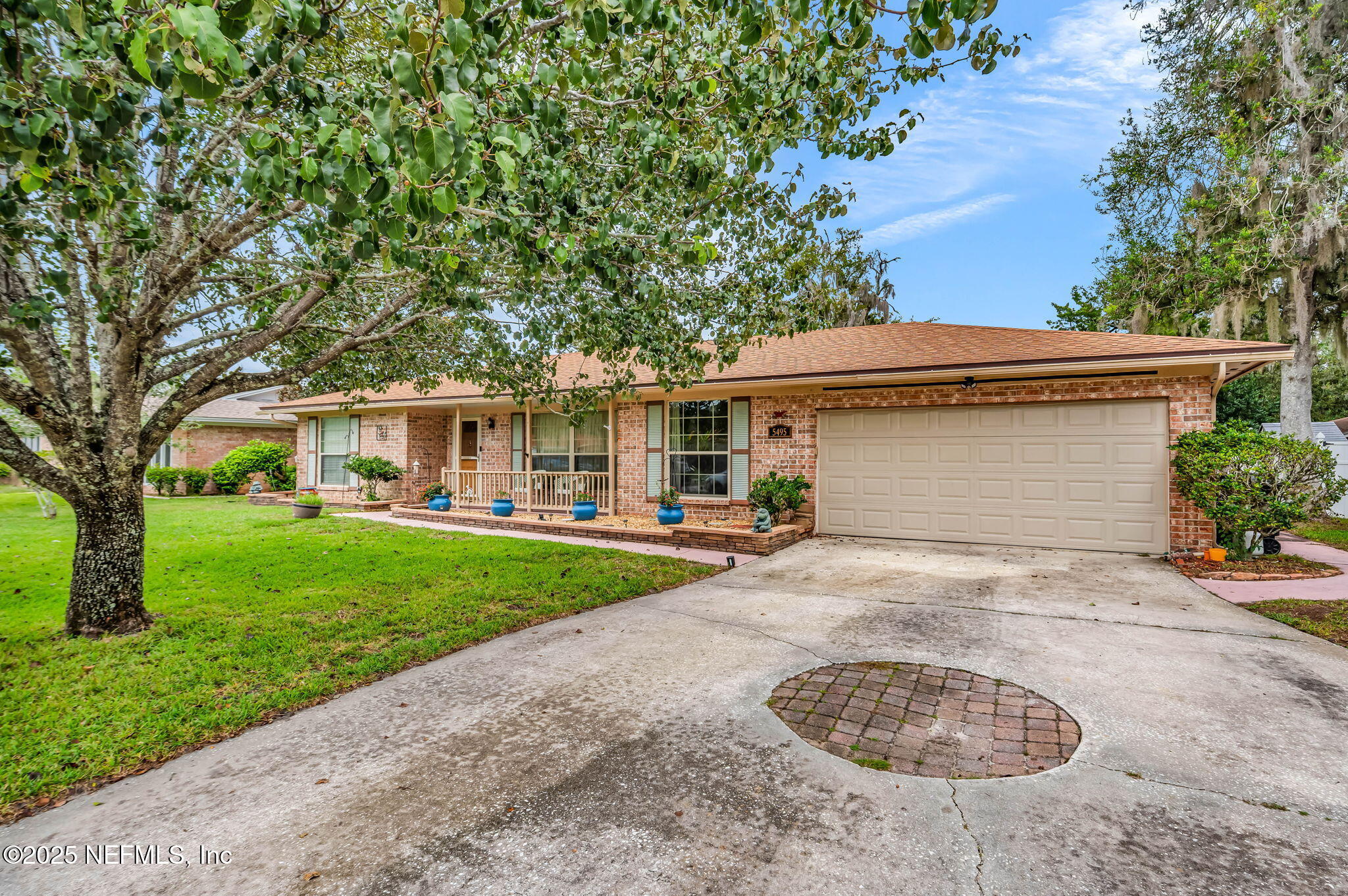 5495 Forrest Drive Orange Park, FL 32073 - Photo 4 of 34 front view of a house with a garden