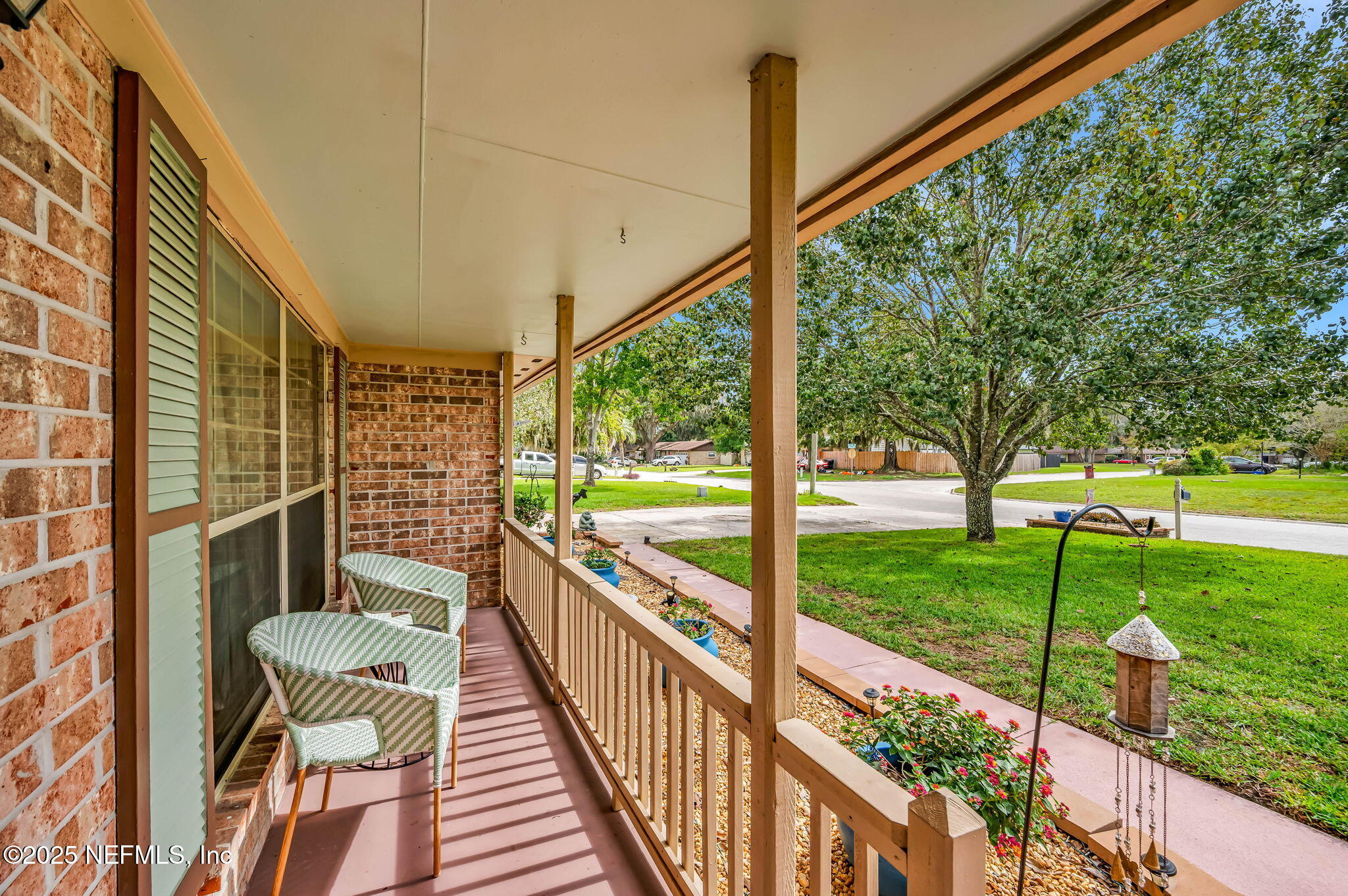 5495 Forrest Drive Orange Park, FL 32073 - Photo 5 of 34 a view of a porch with furniture and garden