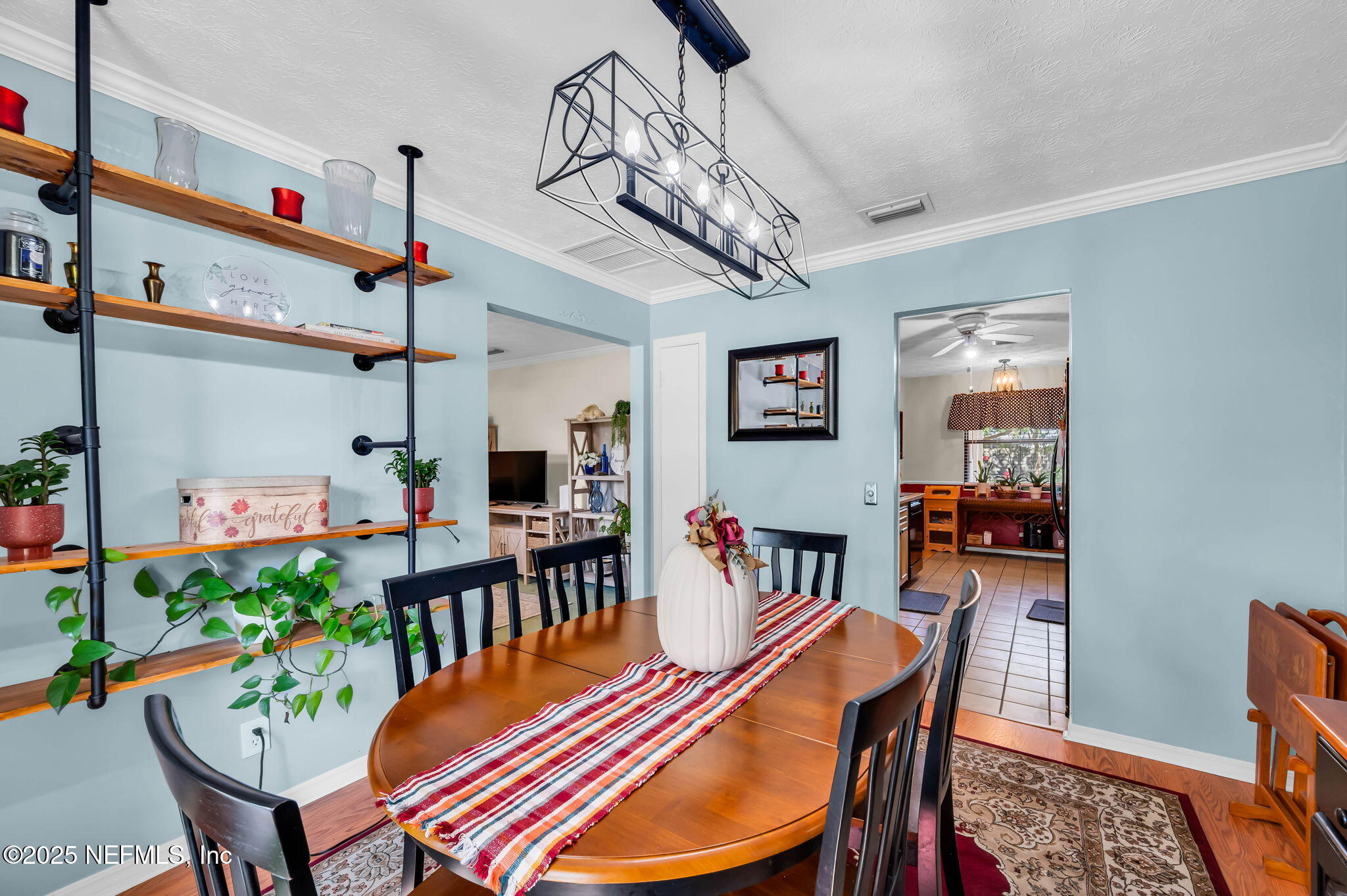 5495 Forrest Drive Orange Park, FL 32073 - Photo 7 of 34 a dining room with furniture and wooden floor