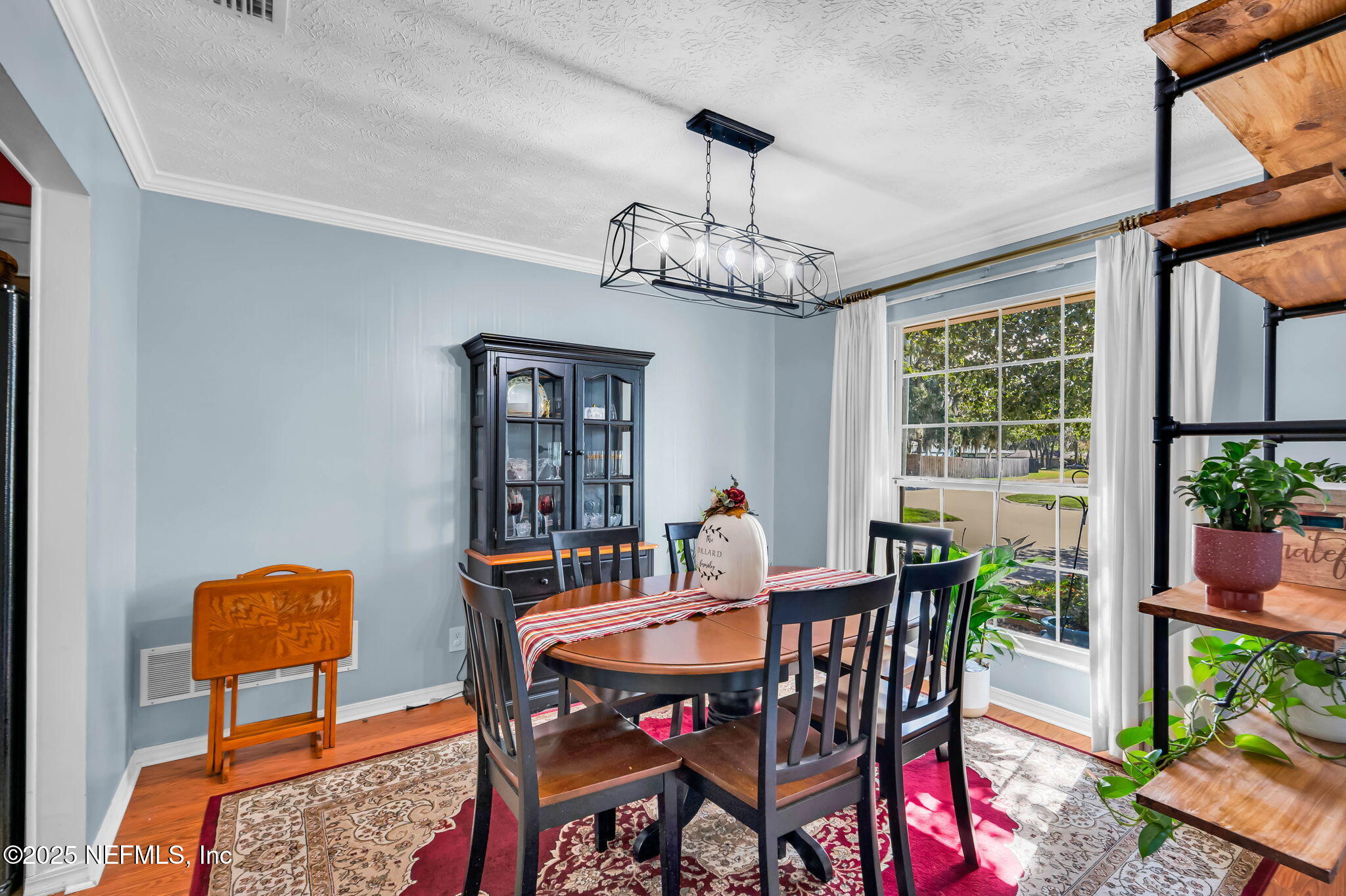 5495 Forrest Drive Orange Park, FL 32073 - Photo 8 of 34 a view of a dining room with furniture window and wooden floor