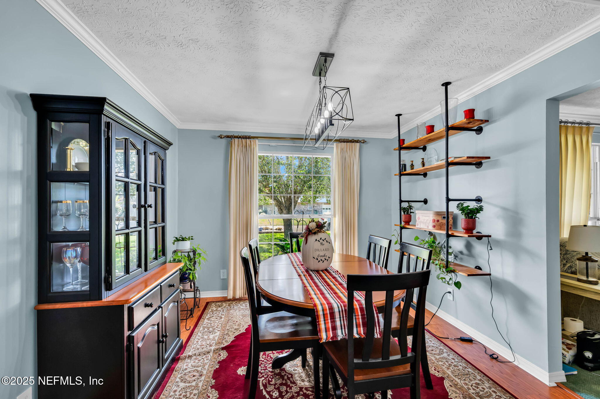 5495 Forrest Drive Orange Park, FL 32073 - Photo 9 of 34 a view of a dining room with furniture window and wooden floor