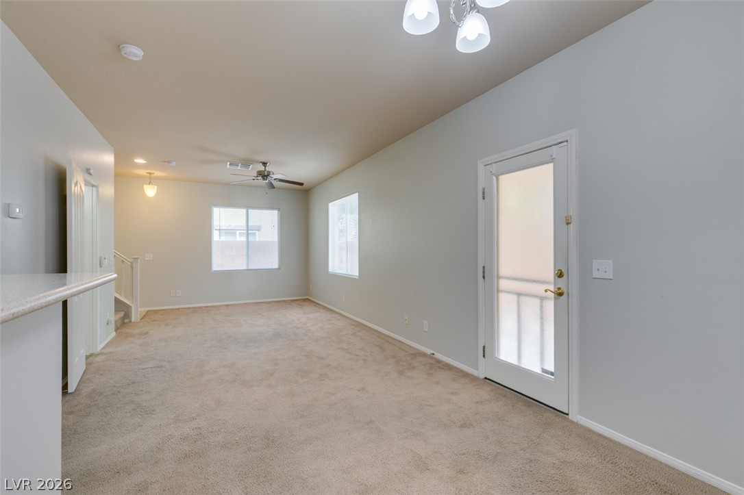 8937 Caledon Ridge Court Las Vegas, NV 89149 - Photo 17 of 43 A versatile living space with plush carpeting, ready for personalized touches.