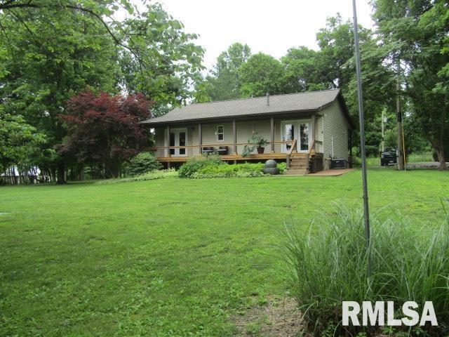 72 Shewmaker Road Cave In Rock, IL 62919 - Photo 2 of 43 a view of backyard of house with outdoor seating and green space