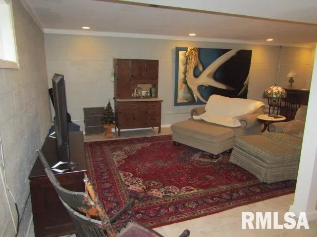 a living room with furniture rug and wooden floor