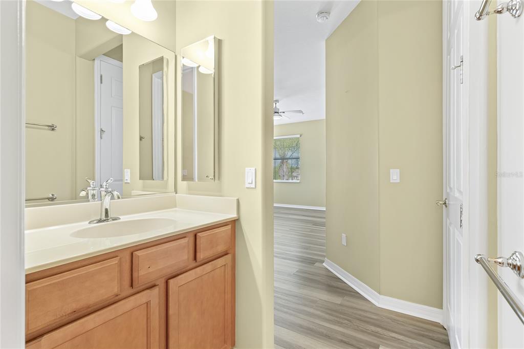 5677 Fossano Drive, Unit 506 Sarasota, FL 34238 - Photo 20 of 44 a bathroom with a sink and a mirror
