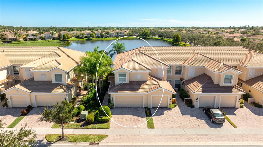 5677 Fossano Drive, Unit 506 Sarasota, FL 34238 - Photo 2 of 44 an aerial view of a house with outdoor space
