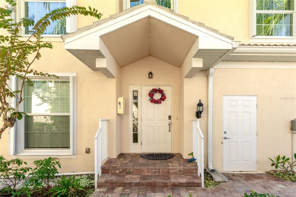 5677 Fossano Drive, Unit 506 Sarasota, FL 34238 - Photo 4 of 44 a front view of a house with a garage