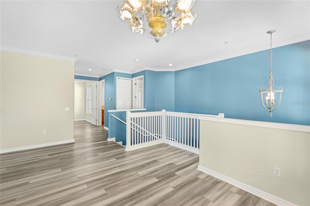 5677 Fossano Drive, Unit 506 Sarasota, FL 34238 - Photo 6 of 44 a view of a room with wooden floor