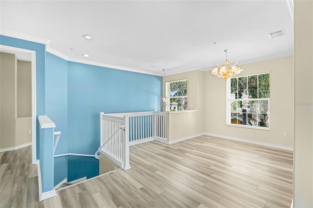 5677 Fossano Drive, Unit 506 Sarasota, FL 34238 - Photo 7 of 44 a view of livingroom with furniture and staircase