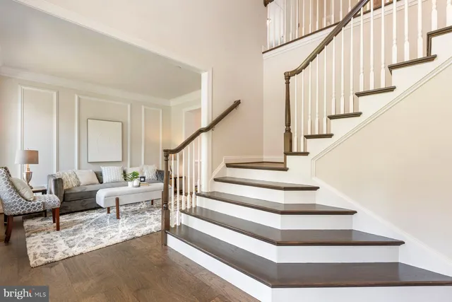a view of entryway livingroom and hall with wooden floor