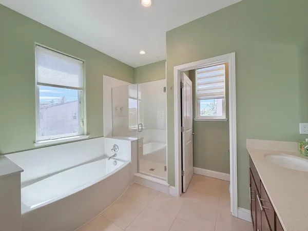a bathroom with a bathtub and a sink
