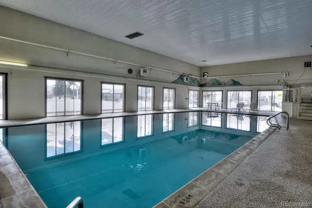 a view of swimming pool from a balcony
