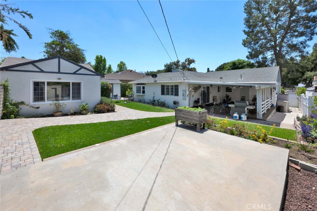 5456 Cadbury Road Whittier, CA 90601 - Photo 52 of 67 a front view of a house with garden