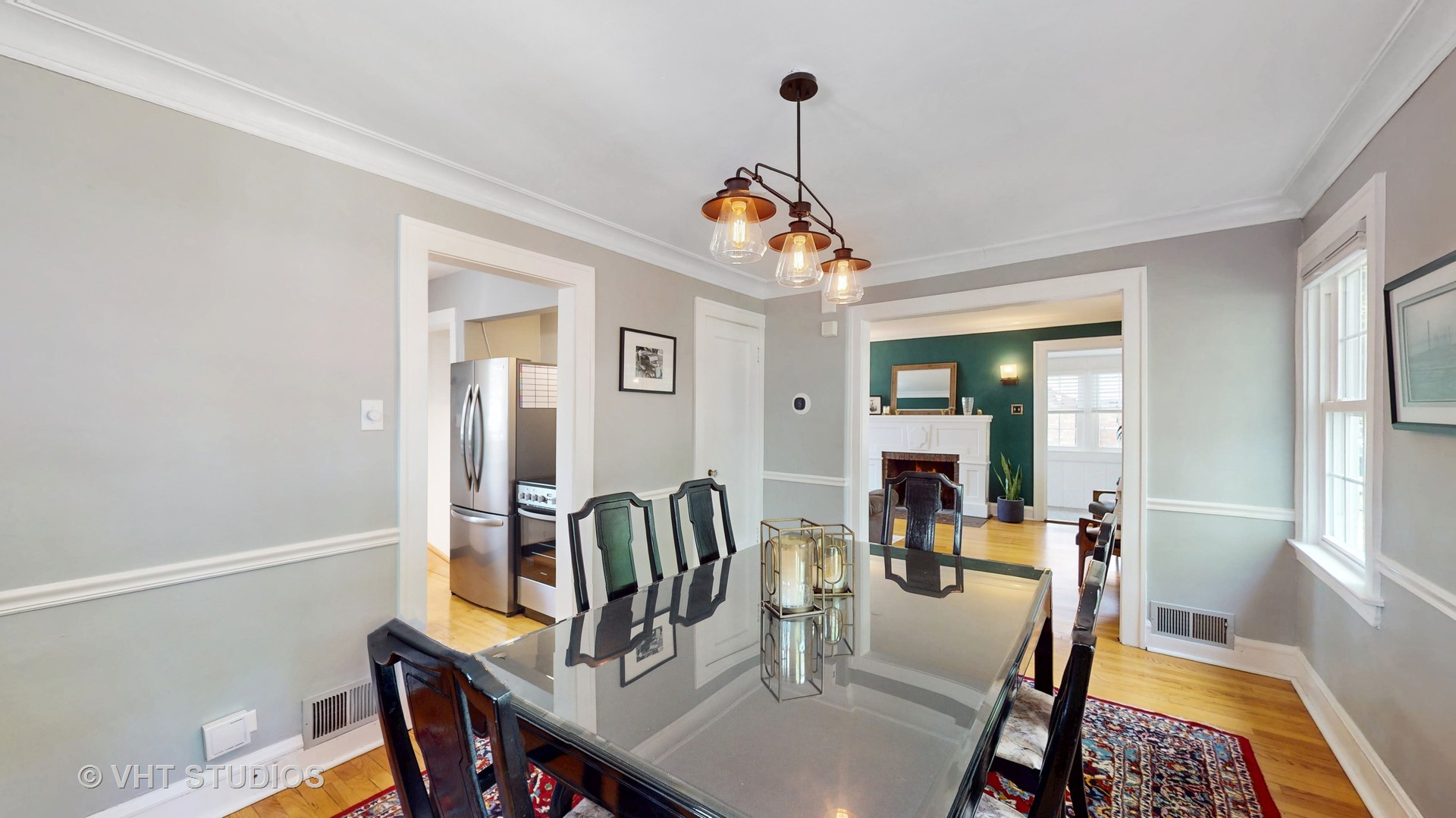 4627 Wolf Road Western Springs, IL 60558 - Photo 8 of 30 a dining room with furniture mirror and wooden floor