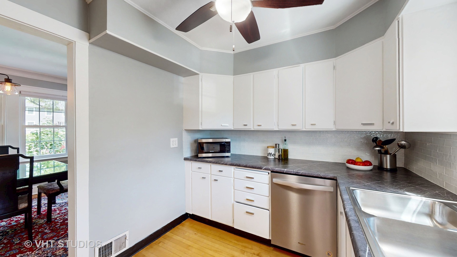 4627 Wolf Road Western Springs, IL 60558 - Photo 10 of 30 a kitchen with granite countertop white cabinets and white appliances